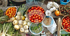 Fresh vegetables on display at a market stall. Assortment of organic produce at a local market. Concept of healthy