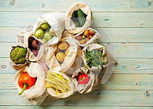 Fresh vegetables in eco cotton bags on table top view