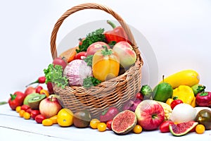 Fresh vegetables and fruit in basket isolated on white