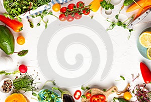 Fresh vegetables, fruits, microgreens and herbs for cooking healthy meals at home. Food frame with copy space, top view