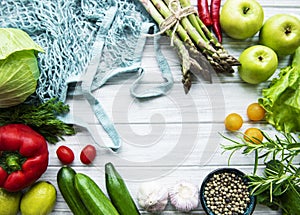 Fresh vegetables and fruits with a string bag