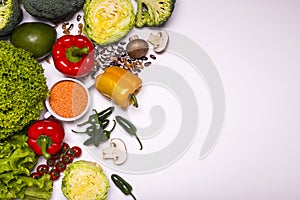 Fresh vegetables and fruits on white background. Detox diet. Different colorful fresh vegan food. Flat lay. Place for