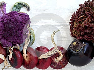 Fresh vegetables from the garden, red onions, eggplant, salad, cauliflower. Harvesting. Seasonal vegetables. Vegetables are