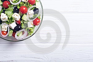 Fresh vegetables greek salad Healthy food on wooden background