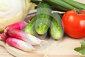 Fresh vegetables on the hardboard photo