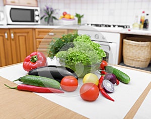 Fresh vegetables on kitchen table.