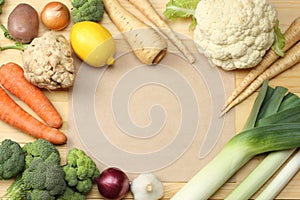 Fresh vegetables on light wooden background. Mockup for menu or recipe. Top view with copy space