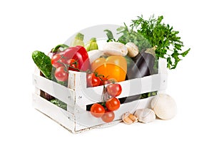 Fresh vegetables in a painted wooden box