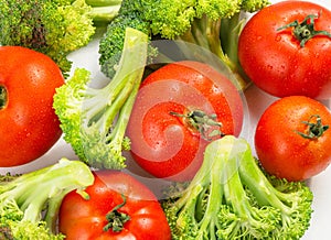 Fresh vegetables are prepared for the vegetable dish: broccoli and tomatoes