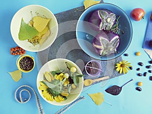 Fresh vegetables, spices, flowers on the table, top view, cooking healthy food