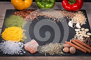 Fresh vegetables, Spices and herbs scattered on dark background. Natural and bio ingredients for cooking Copy space for your text.