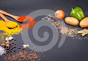 Fresh vegetables, Spices and herbs scattered on dark background. Organic products