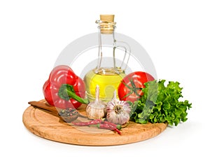 Fresh vegetables , spices and olive oil in a bottle