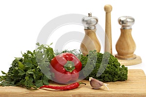 Fresh vegetables and spices on white background.
