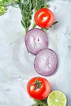 Fresh vegetables still life. Veges lined up on a white background, top view, close-up, selective focus, copy space.