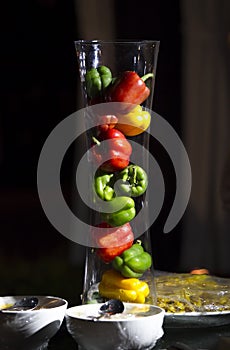 Fresh vegetables of Three sweet Red, Yellow, Green Peppers in jar