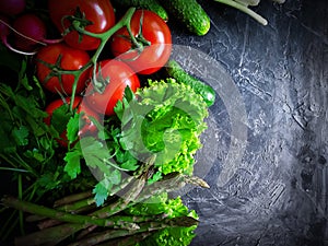 Fresh vegetables, tomato, cucumber, lettuce, culinary gourmet asparagus a concrete background