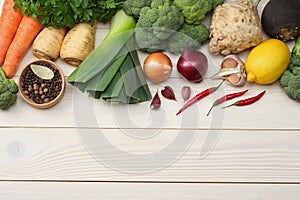 Fresh vegetables on white wooden background. Mockup for menu or recipe. Top view with copy space