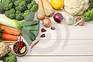 Fresh vegetables on white wooden background. Mockup for menu or recipe. Top view with copy space