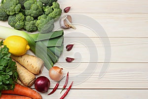 Fresh vegetables on white wooden background. Mockup for menu or recipe. Top view with copy space