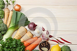 Fresh vegetables on white wooden background. Mockup for menu or recipe. Top view with copy space