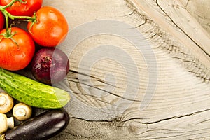 Fresh vegetables on wooden background. The icon for healthy eating, diets, weight loss.