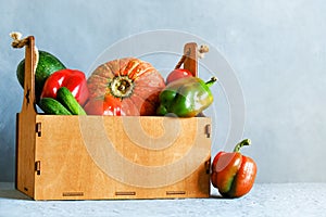 Fresh vegetables in wooden box. Healthy eating, vitamins concept. Organic food background.