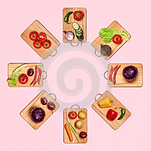Fresh vegetables on wooden chopping boards