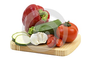 Fresh vegetables on a wooden cutting board