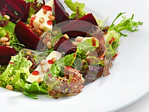 Fresh vegetarian gourmet salad with baked beetroot and cheese