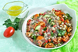 Fresh vegetarian salad with pearl barley and vegetables