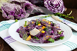Fresh vitamin fitness salad of red cabbage, bell peppers, corn, arugula.