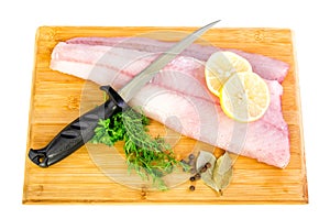 Fresh walleye fillets with knife