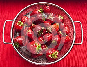 Fresh washed strawberries in a sieve