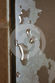 Fresh water drop on hard surface board in the kitchen