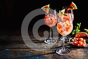 Fresh watermelon cocktails on rustic, dark timber