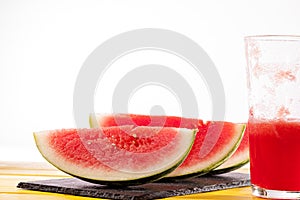 Fresh watermelon slices and juice drink. Thirst quenching refreshing summer smoothie.