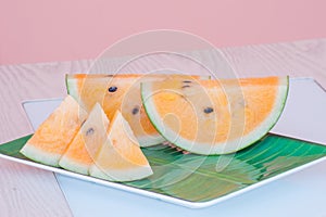 Fresh watermelon yellow on dish.