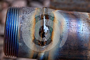 Fresh weld bead on a metal tube macro