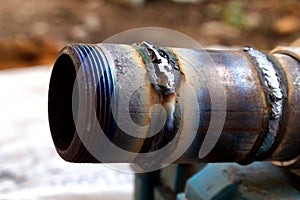 Fresh weld bead on a metal tube macro