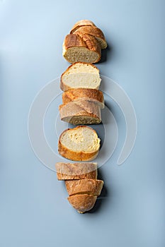 fresh wheat flour baguette on a blue background