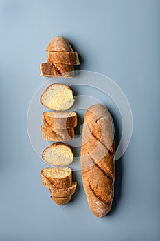 fresh wheat flour baguette on a blue background