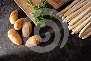 Fresh white asparagus on black background