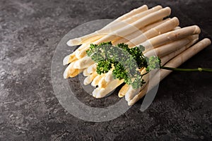 Fresh white asparagus on black background