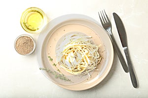 Fresh white carrot salad served with oil and spices on table, flat lay