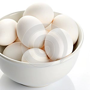 Fresh white eggs in a white bowl isolated on white background