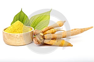 Fresh white galingale  finger root galingale powder in a wooden cup. Thai herbs to prevent covid-19
