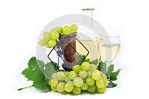 Fresh White Grapes with Green Leaves, Wine Glass Cup and Wine Bottle Filled with White Wine Isolated on White