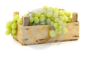 Fresh white grapes in a wooden box