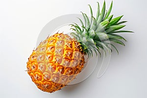 Fresh Whole Pineapple Lying on a Clean White Background A ripe pineapple with vibrant green leaves starkly contrasts against a